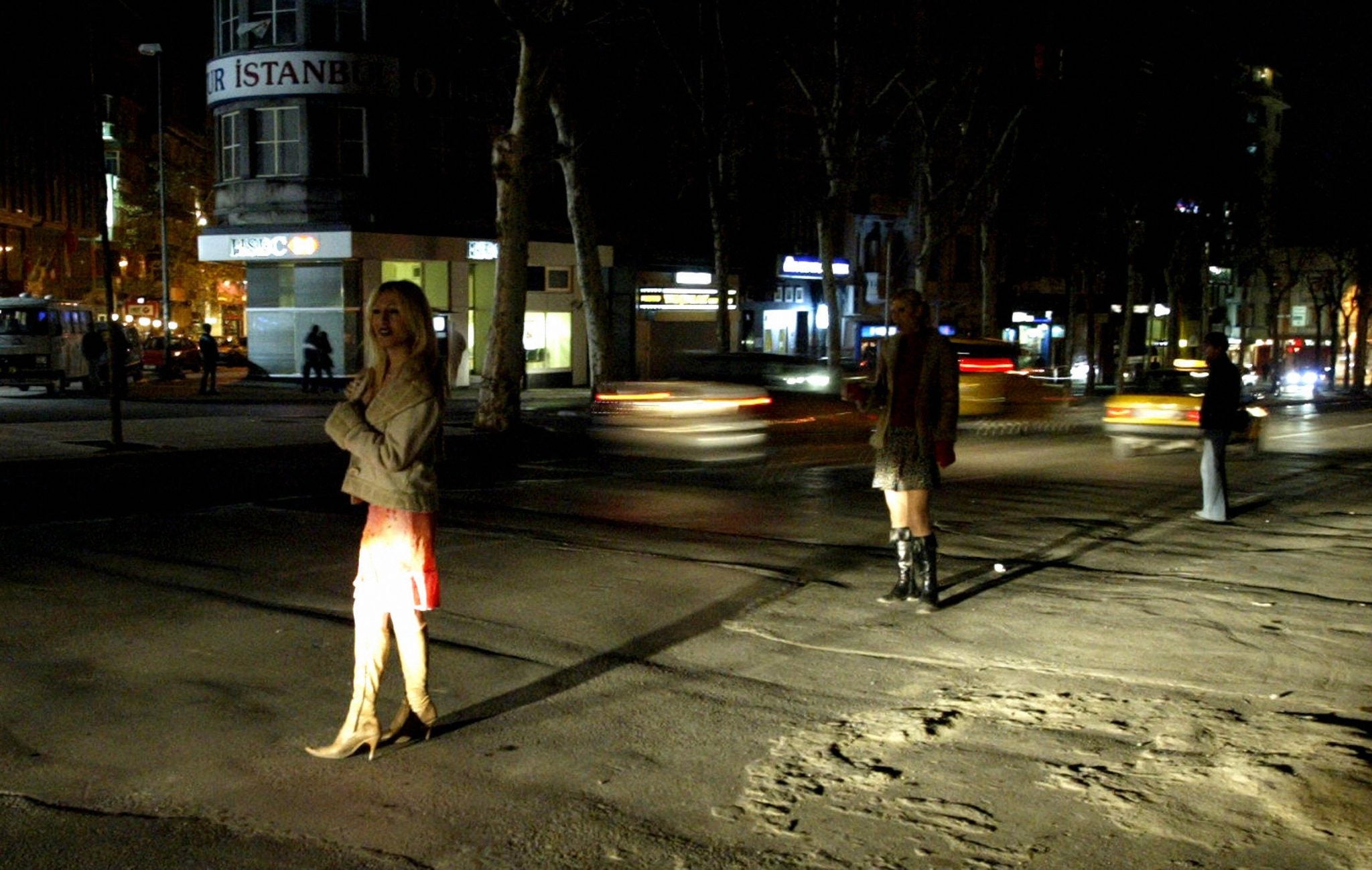 ISTANBUL, TURKEY: Two unidentified transsexual prostitutes stand near the m...