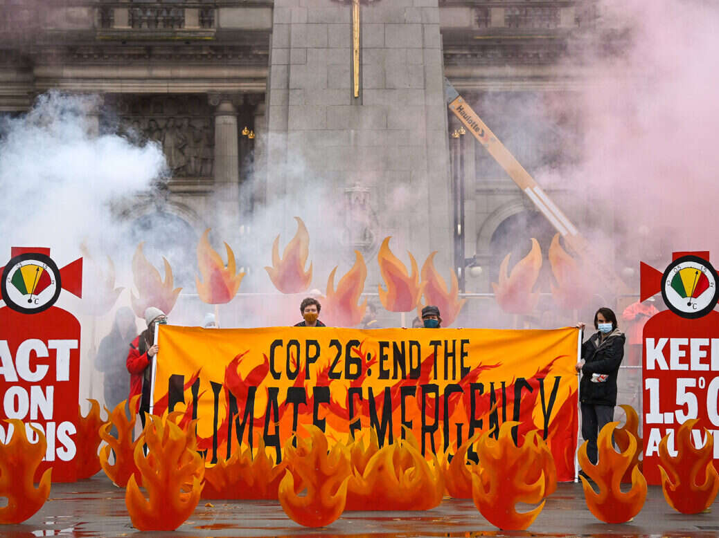 Activists create a field of climate fire to welcome delegates to the Cop26 climate talks in Glasgow.