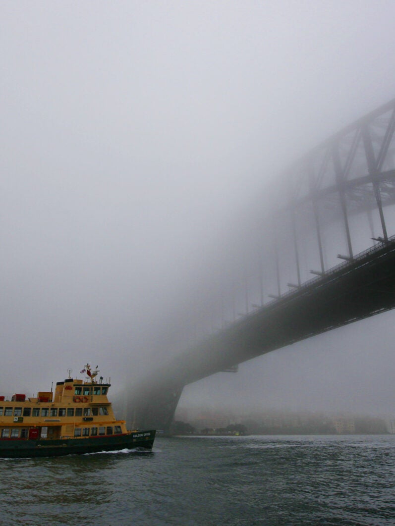 Sydney Harbour in early morning fog. (Photo by Steve Christo/Corbis via Getty Images)