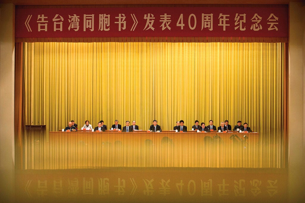 Xi Jinping (centre) at the Great Hall of the People in Beijing, 2 January 2019, giving a speech in which he described unification with Taiwan as “inevitable”