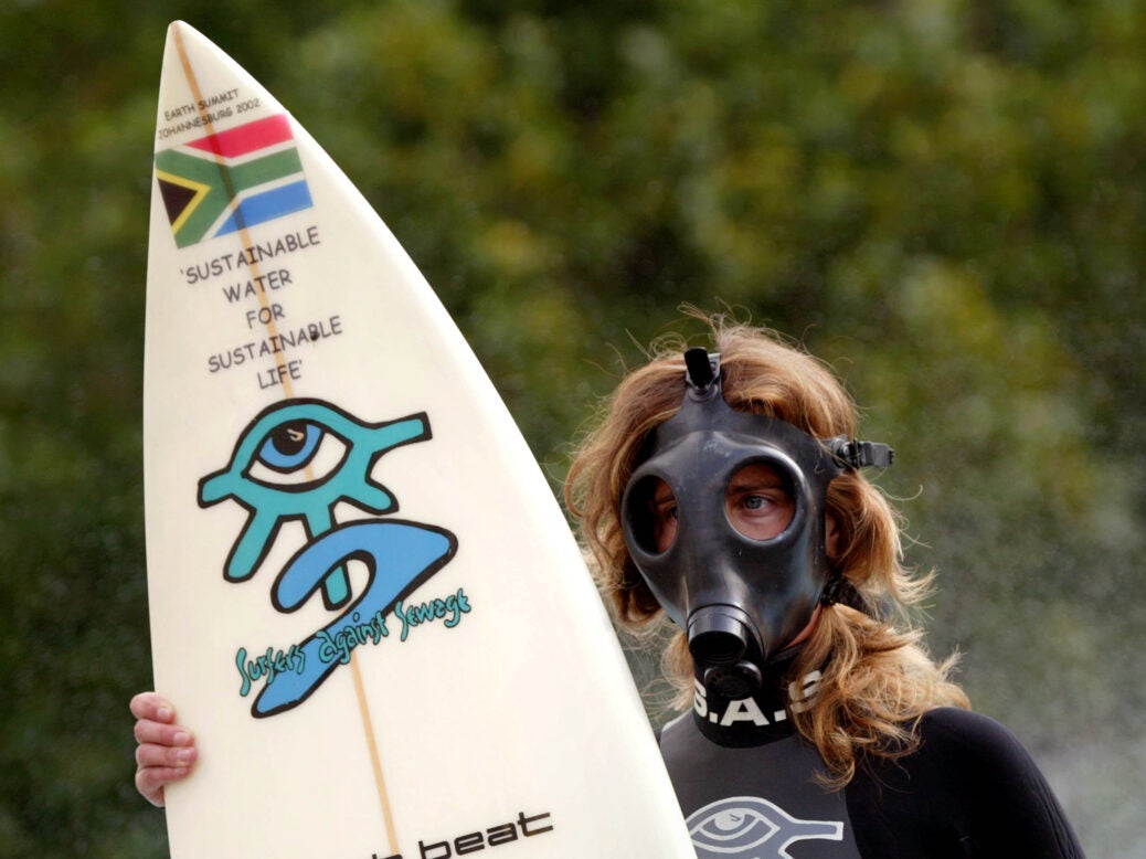 surfer against sewage campaigner wearing gas mask